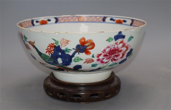 An 18th century Chinese verte Imari bowl on wood stand, c.1740, diameter 26cm